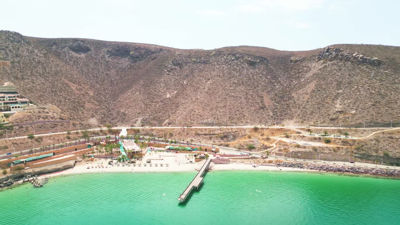 Relaxed beach scene at Playa Coromuel, La Paz with calm turquoise waters