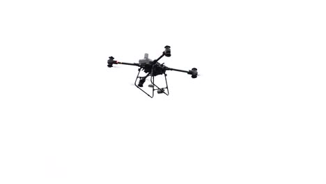 Aerial-delivery-industrial-drone-hover-in-bright-sky-and-lower-winch-system