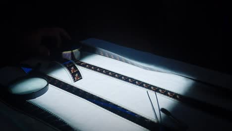 film reel being examined