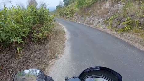 motorcycle-rider-ridding-bike-in-forests-trails-at-day-from-flat-angle