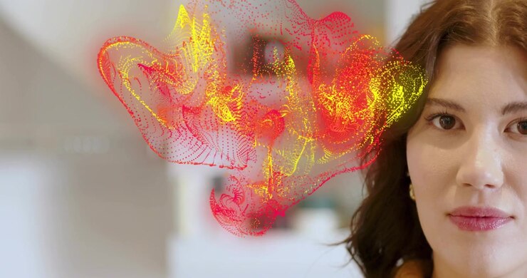 Woman in kitchen observing holographic mesh forming above head, following it and showing AR tech