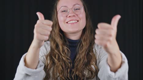 stable shot, looking at camera, excited woman showing thumbs up