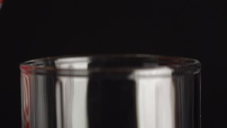 pouring christmas soda into a glass