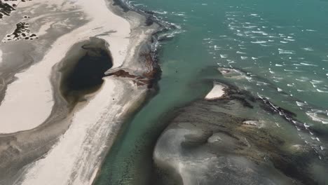 Aerial-Drone-above-Lone-Kitesurfer-Dunes-in-Brazil,-Jericoacora-Tourism-Reserve,-Relaxing-Ocean-and-Desertification