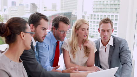 Business-people-working-together-at-meeting-on-laptop