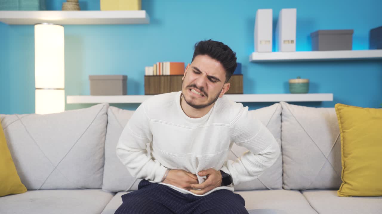 Young man with stomachache.