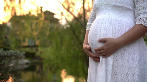 Pregnant-woman-feeling-happy-at-garden-home.