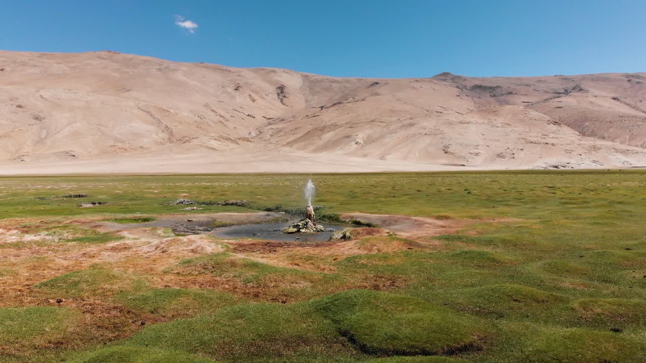 Geyser in a mountain landscape