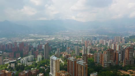 Beautiful-Aerial-Establishing-Shot-High-Above-Apartment-Buildings-in-El-Poblado,-Medellin,-Colombia
