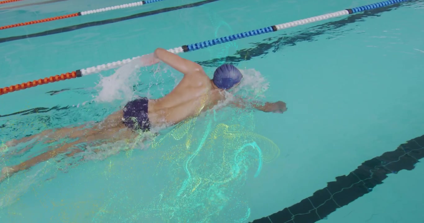 Male athlete pushing off pool wall gliding with water trails starting freestyle stroke for fitness