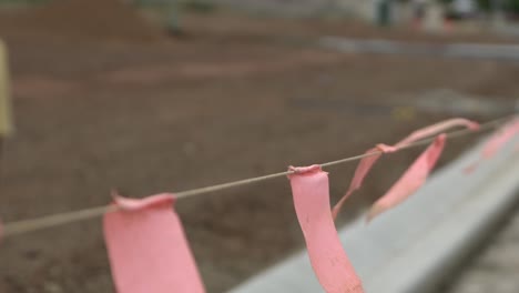 Red-flags-roadworks-closed-focus-dirt