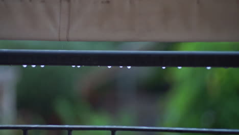 Footage-of-balcony-rail-guard-with-raidrops-falling-CLOSEUP