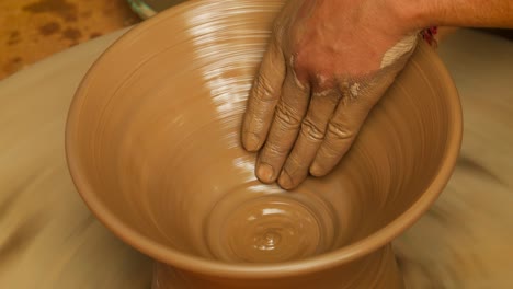 potter at work makes ceramic dishes. india, rajasthan.