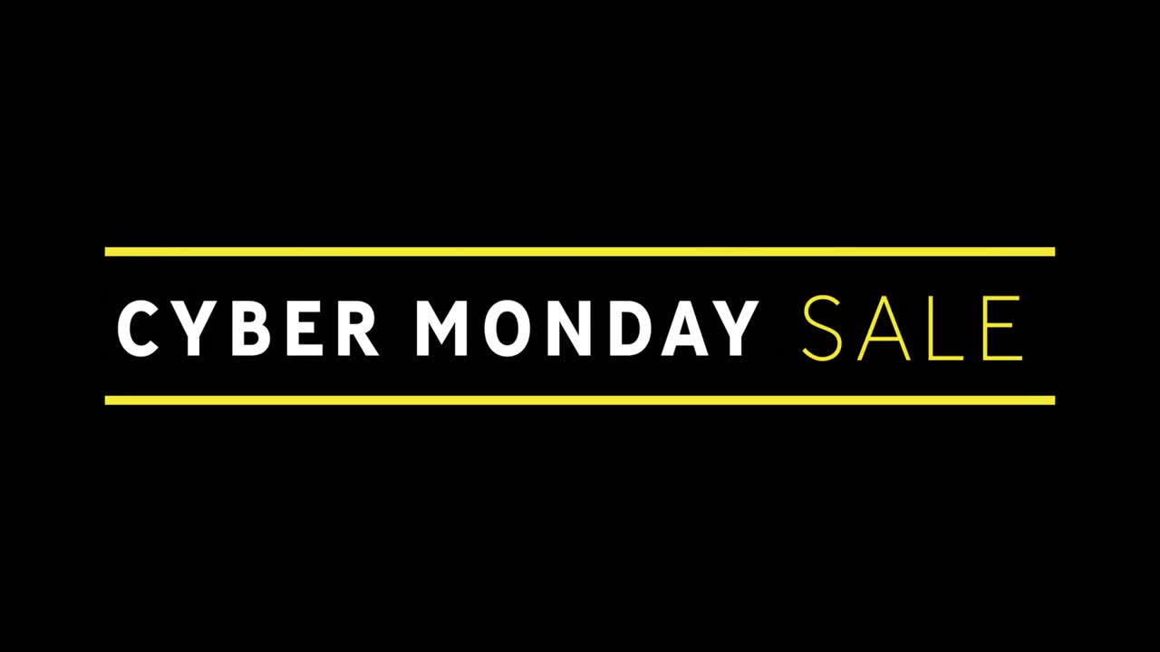 texto de venta blanco y amarillo de cyber monday que aparece contra una pantalla negra