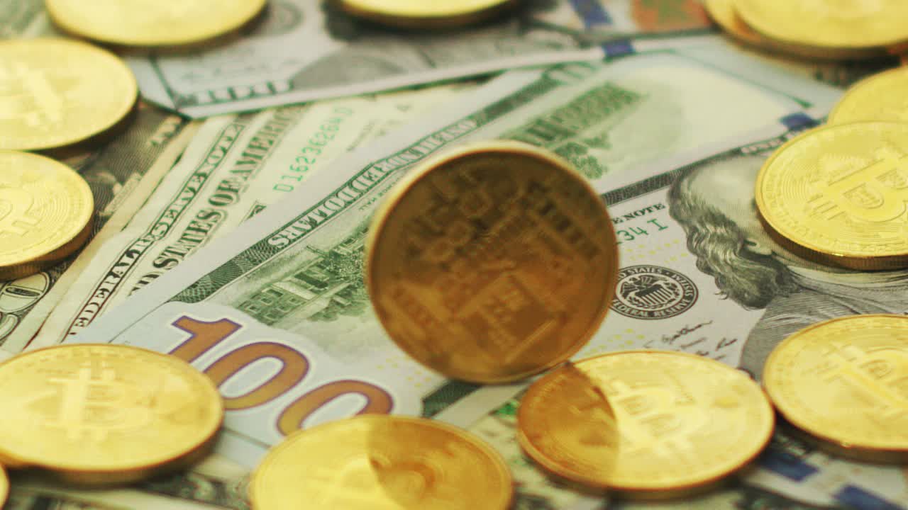Bitcoin and dollars in pile