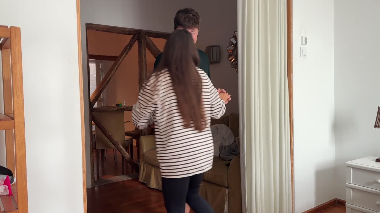 Couple Hugging and Dancing in a Home