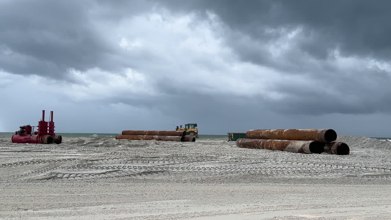 Stacked pipes used to pump ocean floor sand for beach replenishment