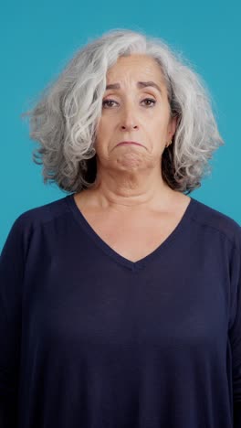 portrait of a senior woman with a sad and disappointed expression