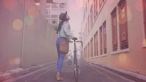 animation of light spots over asian woman walking with bicycle