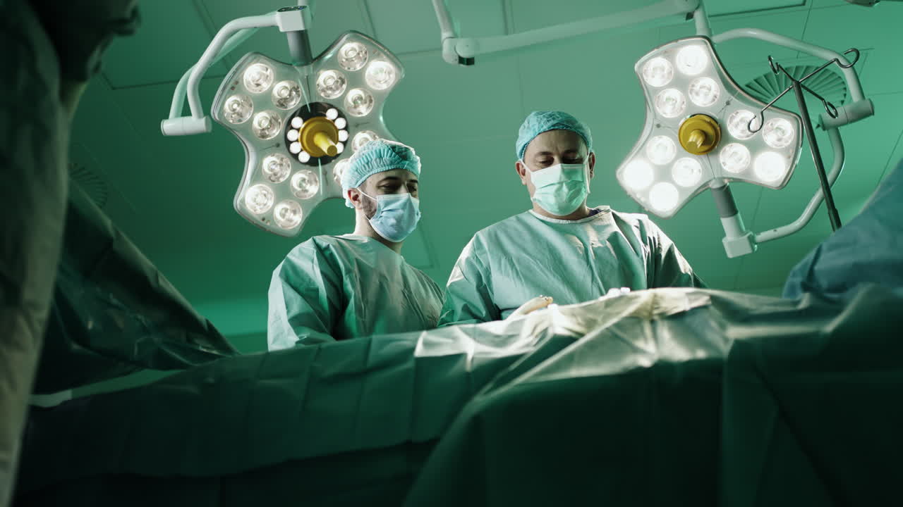 Surgeons performing an operation in a sterile operating room