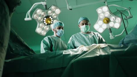 surgeons performing an operation in a sterile operating room