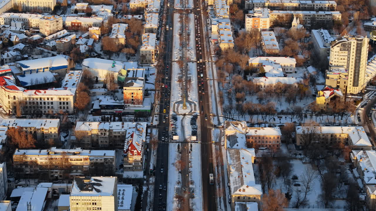 Aerial drone view of Chisinau city center, covered in snow at sunset. Winter in Moldova