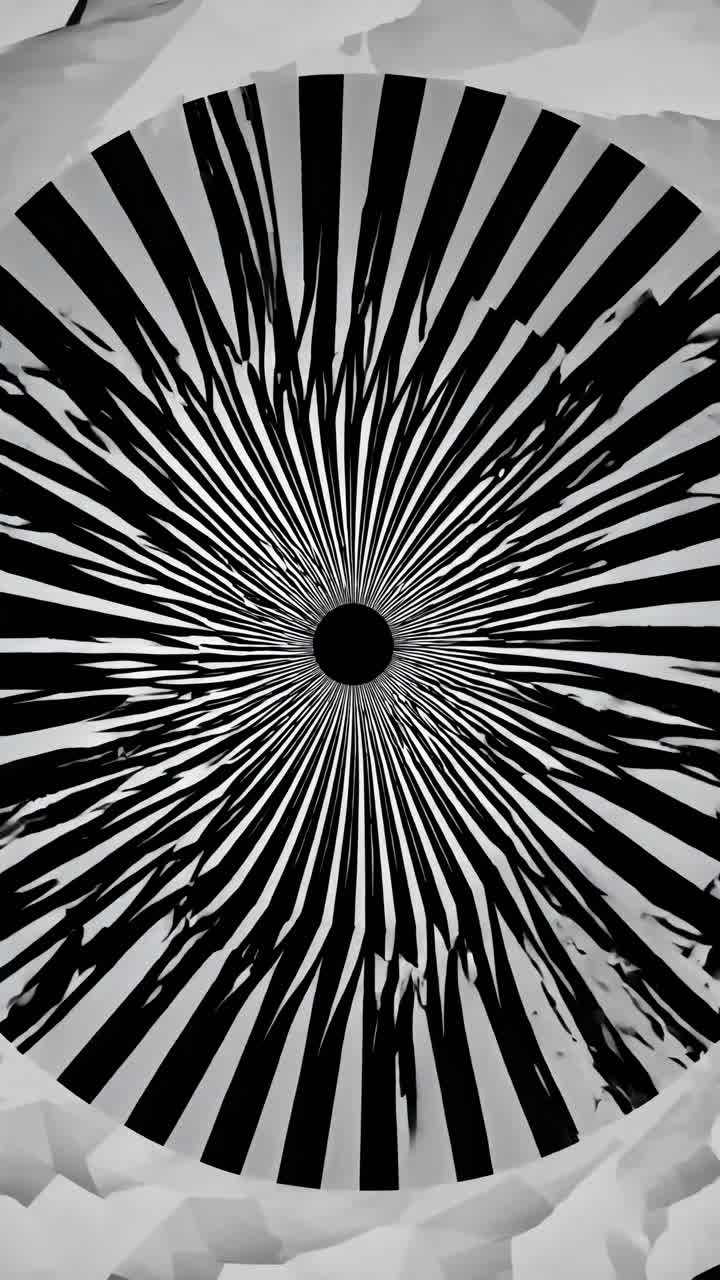 Abstract black and white radial pattern resembling a vortex, captured from a top-down angle