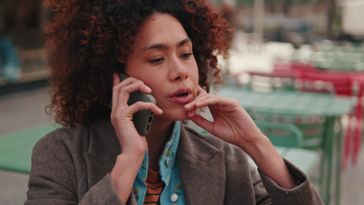 Young Woman Talking on Phone Outdoors