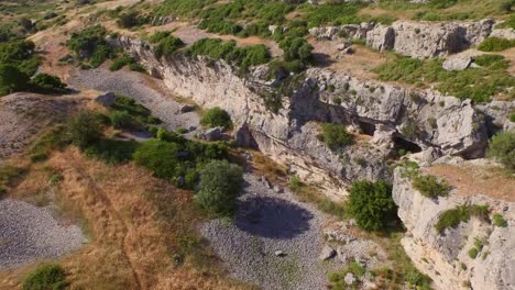 aerial: a monastery and caves in the mountains of samos, greece