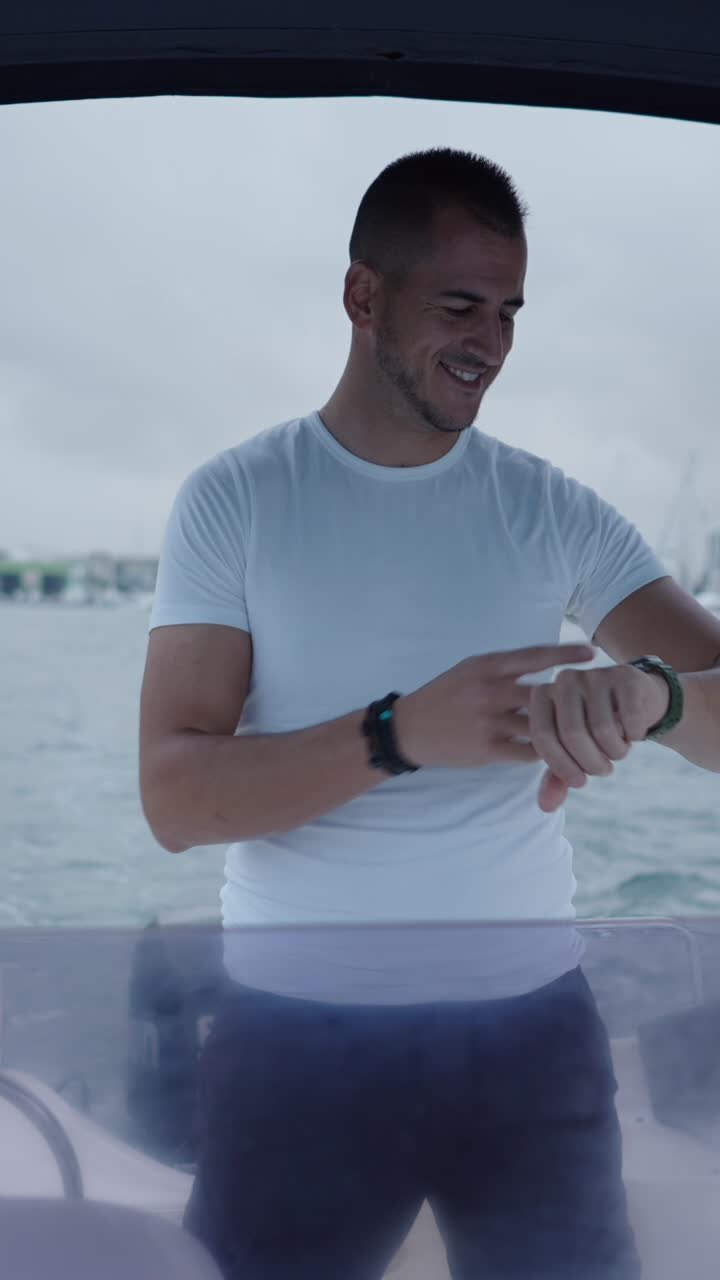 Man checking the time on a boat