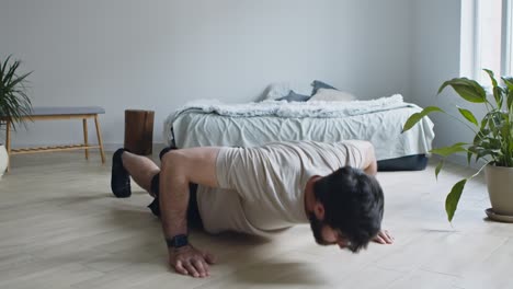 man doing push-ups at home