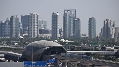 a dubai metro train heads to its next stop along sheikh zayed road in dubai, uae