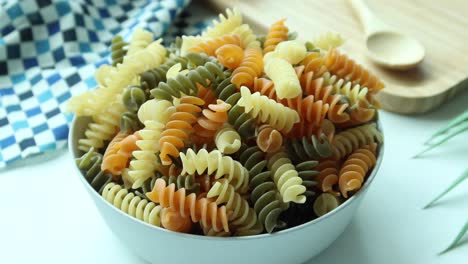 Dry-ful-pasta-in-a-bowl-on-white-background-,