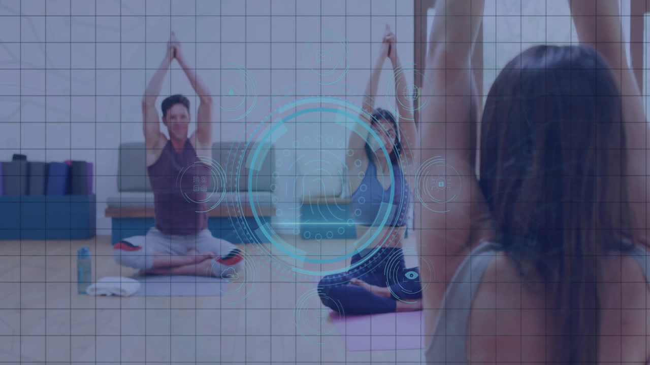 People practicing yoga in studio with digital interface animation overlay