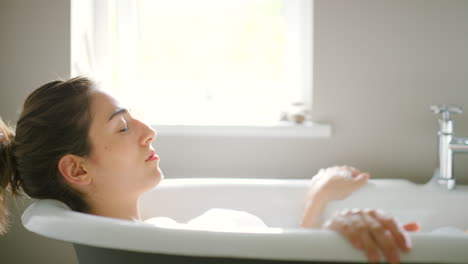 woman relaxing in a bubble bath