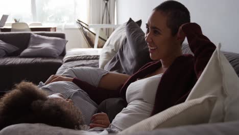 lesbian couple romancing in living room