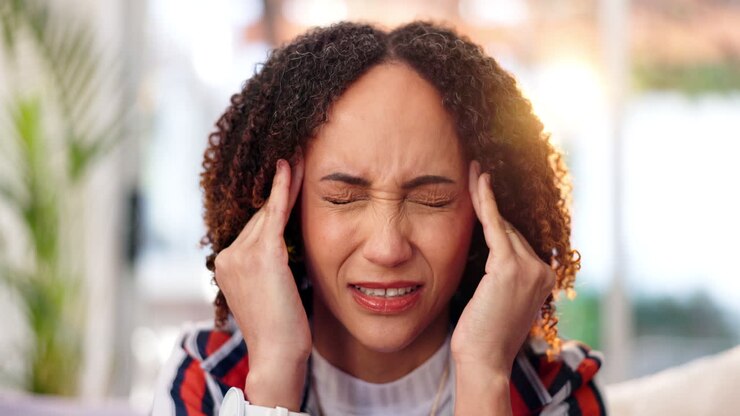 Woman suffering from headache and stress