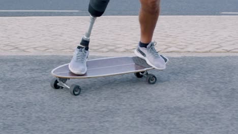 man with prosthetic leg pushing away and balancing on board