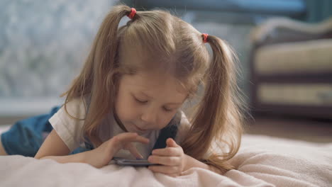 low angle shot: little girl lies in room