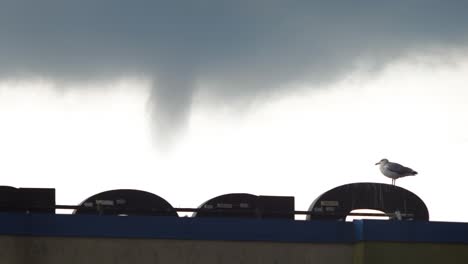 waterspout funnel forming in the sky