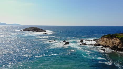 rocky headland and the off shore sea rocks of jerusalem beach in erisos, kefalonia, greece