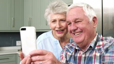 smiling old people taking a selfie