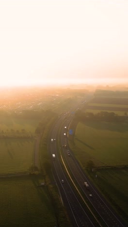 highway at sunrise through fog