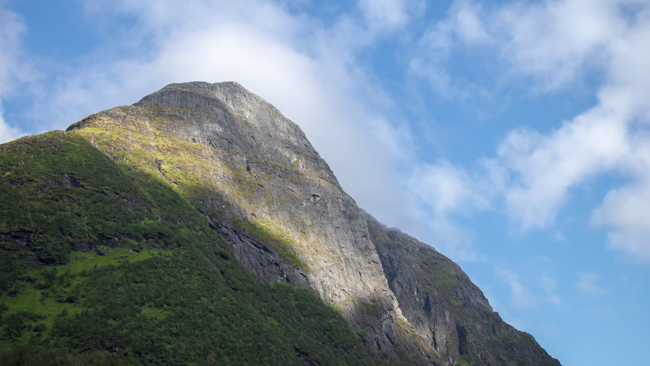 Timelapse of a mountian where clouds are passing by
