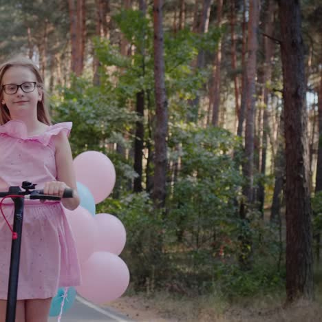 hilarious child rides a scooter decorated with balloons 1