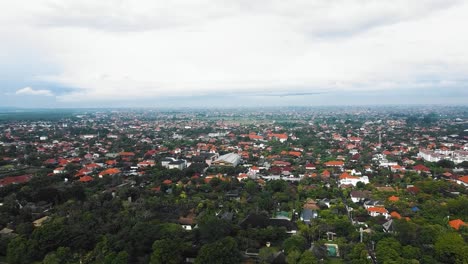 beautiful cinematic sanur beach, bali drone footage with interesting landscape, fishing boats, village houses, hotels, resorts and calm weather