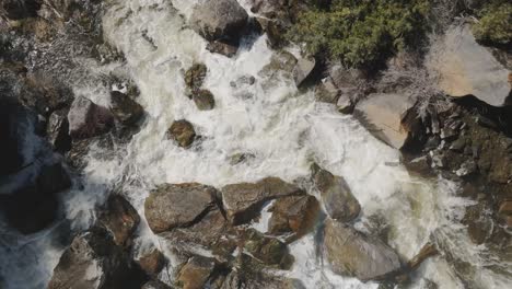 Rushing-river-flows-over-rocks-in-Owen-Sound,-Canada,-aerial-view