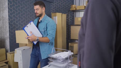 online store employee shipping orders at dropshipping delivery service warehouse.