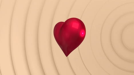 animación de un corazón giratorio sobre un fondo beige