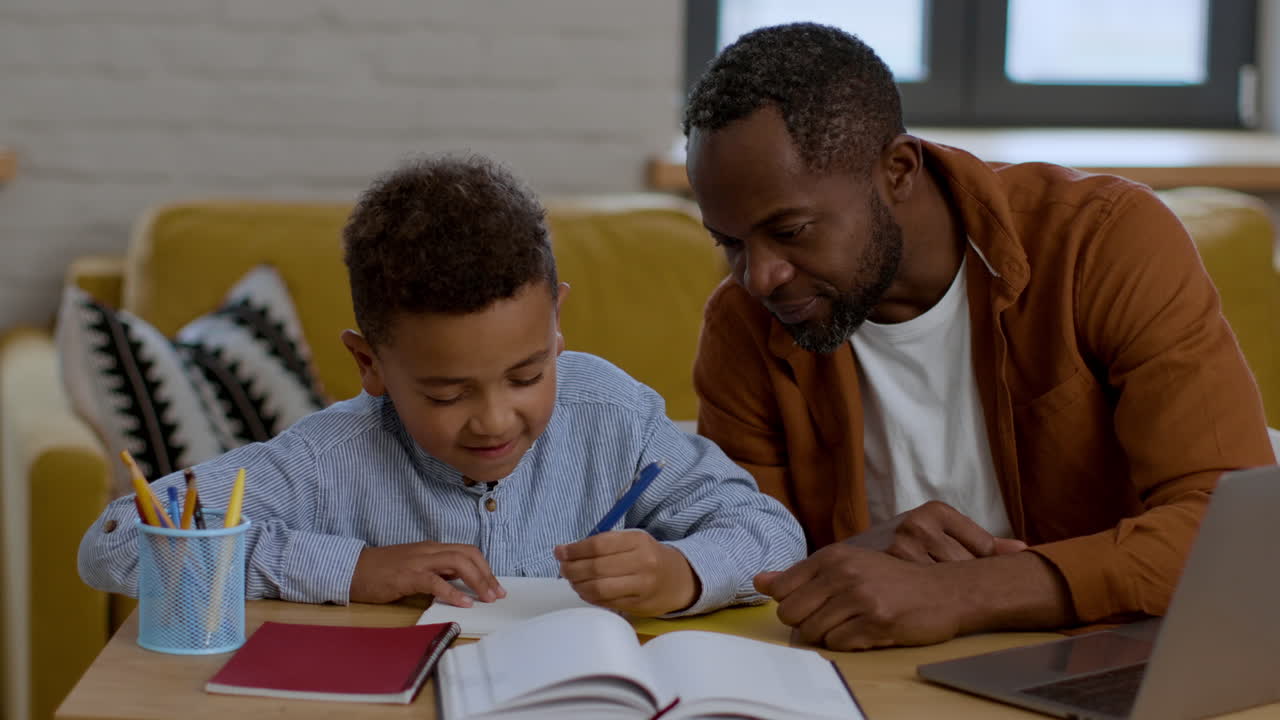 Father teaching his son at home